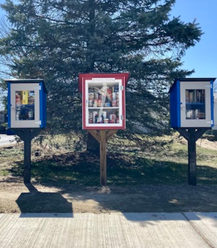 This picture shows the three little free pantries next to the library.